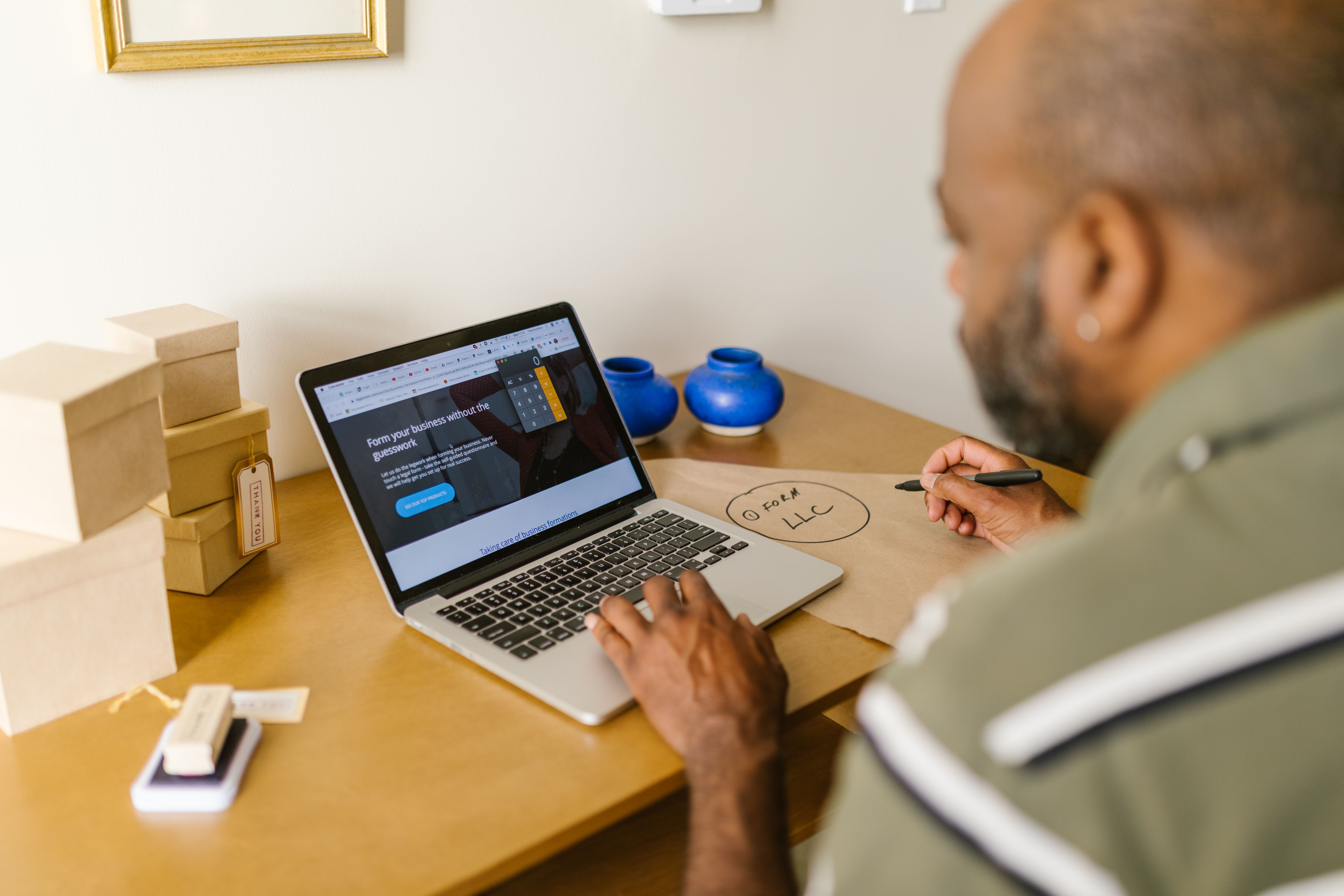 Business owner reviewing company records for an unclaimed property claim