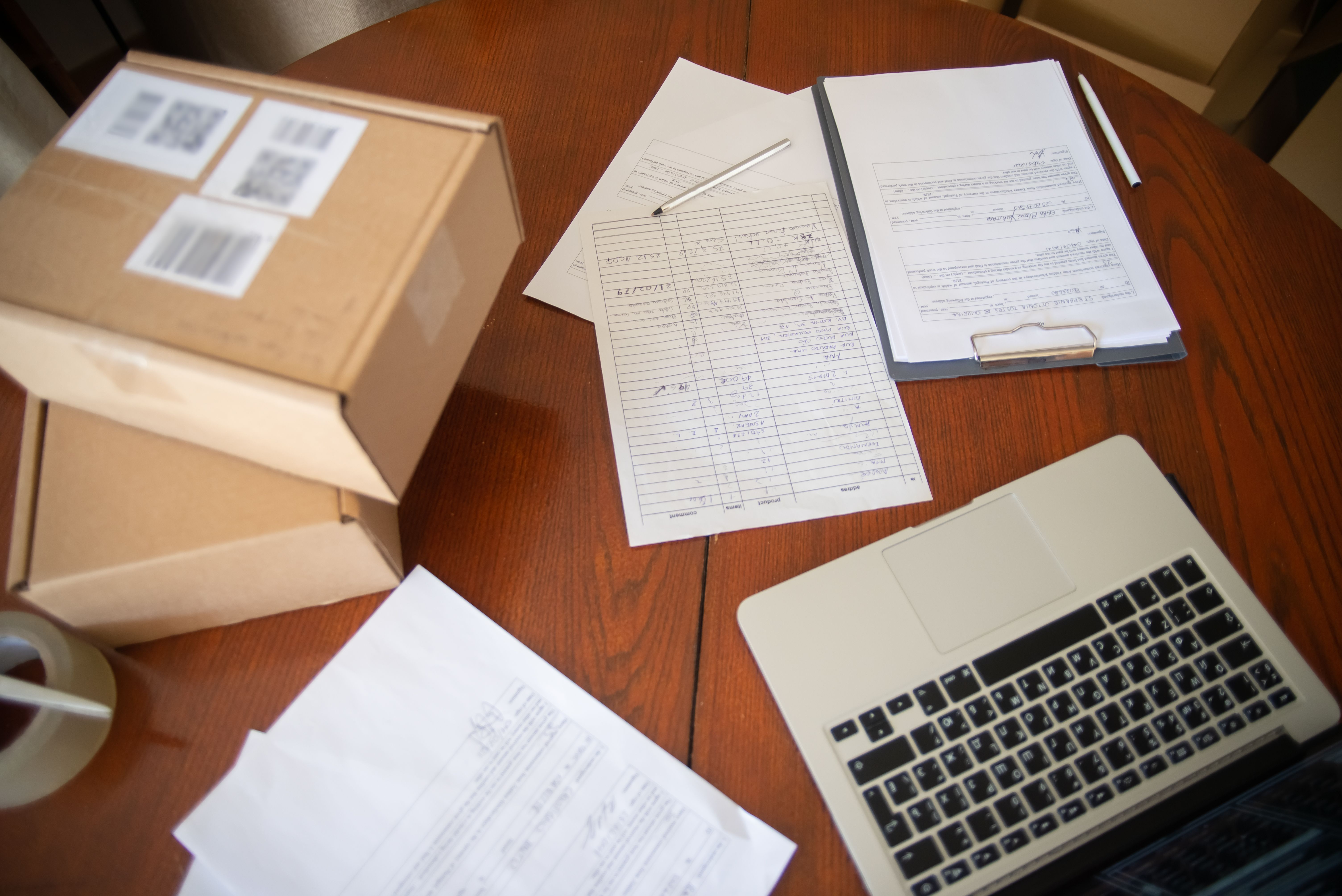 Connecticut claimant reviewing financial paperwork at home